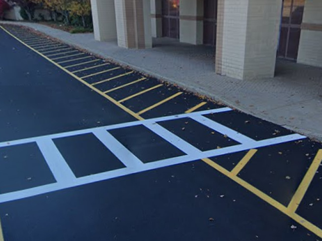 Yellow stripes painted in a parking lot