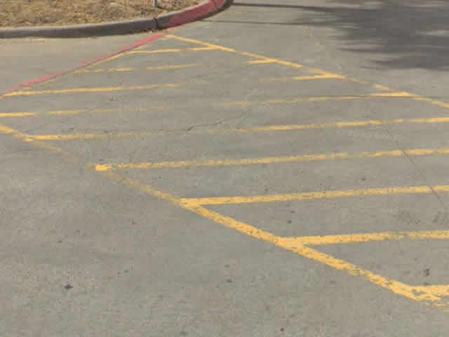 Faded Lines In Parking Lot Needing Restriping